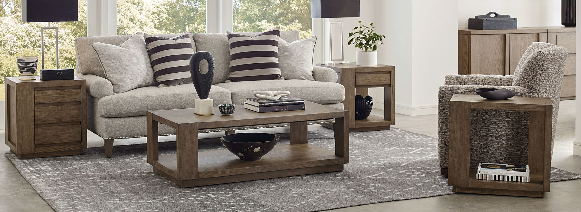 a living room with a couch, chair, and coffee table
